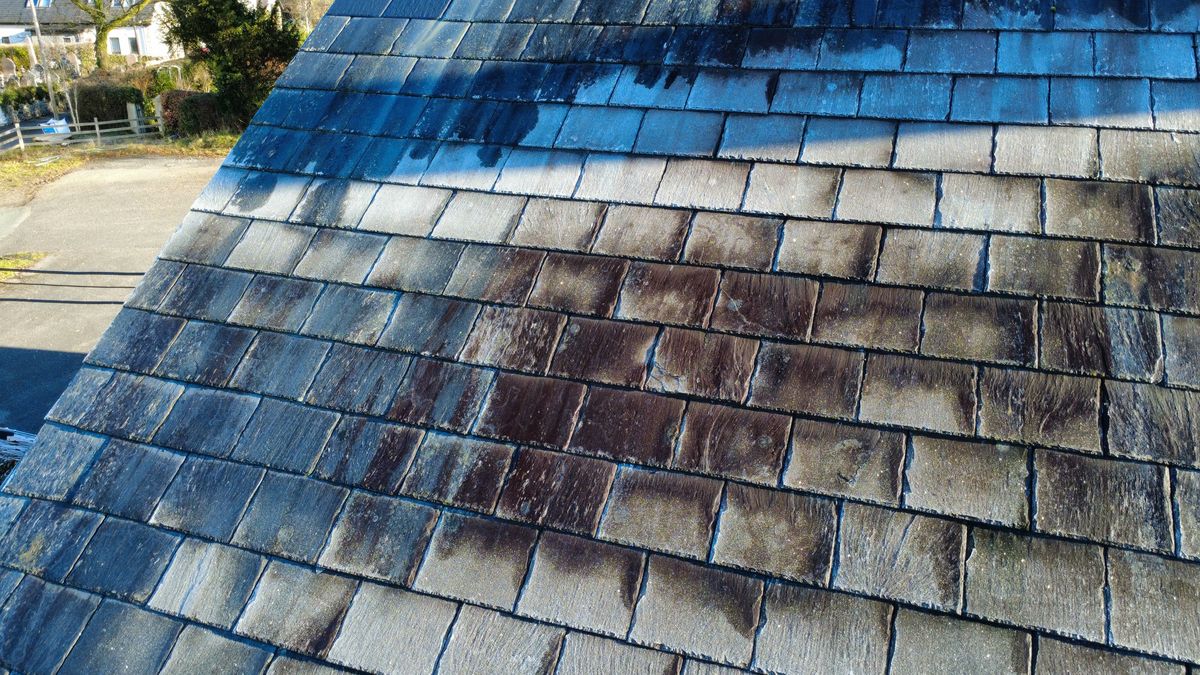 Close-up drone photo of a frosty slate roof